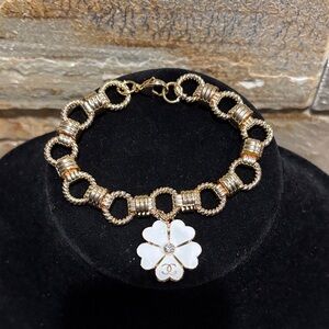 Gold plated Bracelet with White Designer Flower charm.